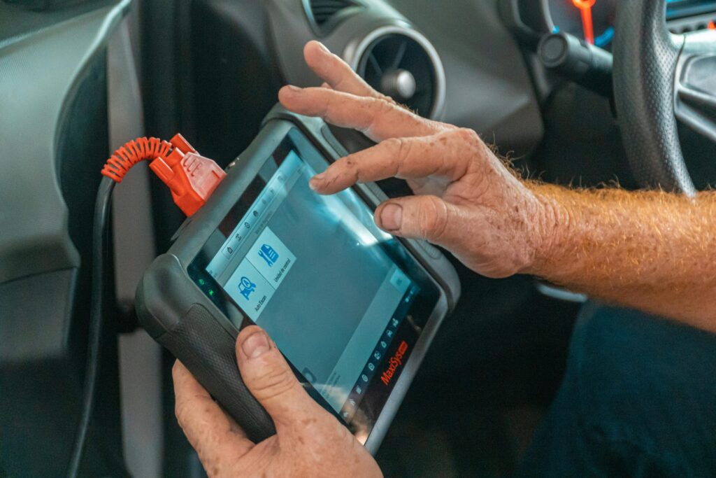 check engine light diagnostic test in howell pexels-lumierestudiomx-4116193 picture of a tech from howell running a diagnostic test on a car because the check engine light is on
