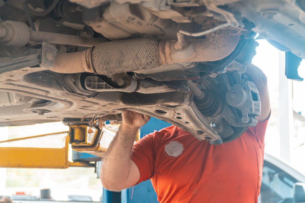 mechanic repairing transmission